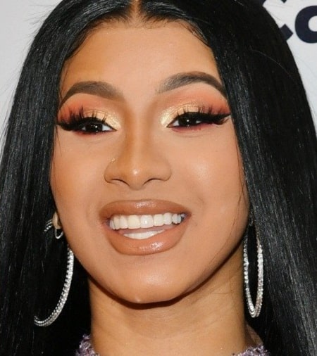 A picture of Cardi B flauting her $40K smile.